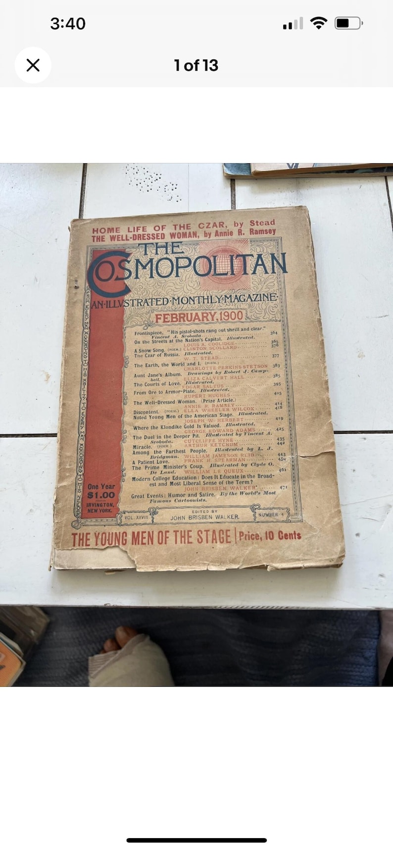 May include: A well-worn February 1900 edition of The Cosmopolitan magazine. The cover displays the magazine's title in red and cream, along with the issue's details. The magazine shows signs of age and use.