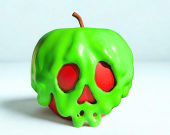 Könnte beinhalten: Ein roter Apfel mit einem grünen, schädelartigen Design. Das grüne Design hat einen tropfenden Effekt, wobei Rot durch die Augenhöhlen und den Mund sichtbar ist. Oben befindet sich ein kleiner brauner Stiel.