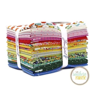 May include: A stack of 20 colorful fabric squares with a variety of patterns, including floral, polka dot, and geometric designs. The fabric is bundled together with a white label that reads "Free Spirit".