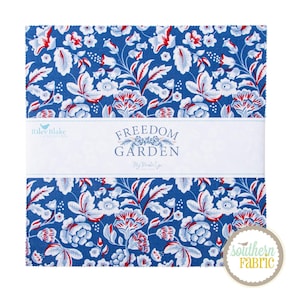 May include: A stack of fabric squares with a floral pattern in blue, white, and red. The fabric features a repeating design of stylized flowers and leaves. The text "FREEDOM GARDEN" is printed on a white band across the fabric.