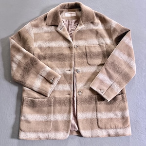 May include: A brown and white striped wool jacket with a button closure and two pockets. The jacket has a collar and a lined interior.