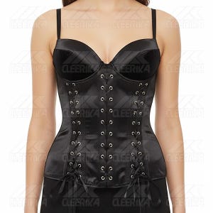 May include: Black satin corset with adjustable straps and a sweetheart neckline. The corset features a lace-up front with silver eyelets and ribbon ties. Designed to cinch the waist and create a defined silhouette.