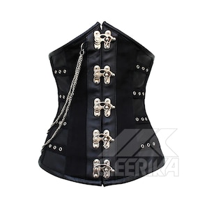 May include: Black corset with silver clasps and a chain detail. The corset has a structured design with multiple panels and decorative rivets. The front closure has five clasps. The corset is made of a matte material.