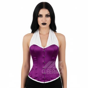 May include: A purple satin halter corset with a white collar and trim. The corset has a row of silver-toned buttons down the front and a structured bodice. The garment is designed with a flattering silhouette and is suitable for various occasions.