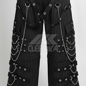 May include: Black and white pinstripe trousers with multiple pockets and decorative chains. The trousers feature straps, metal rings, and a drawstring waist. The style is reminiscent of alternative fashion.