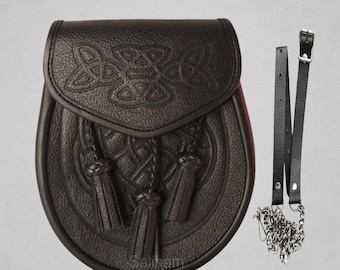 May include: A black leather sporran with Celtic knotwork detailing and three tassels. It has a matching leather strap and silver chain. The text "Premium Quality Sporran" is at the top.