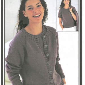 May include: A long-sleeved cardigan with a button-up front and a round neckline. The cardigan is a dark purple colour and is made of a soft, knitted fabric.