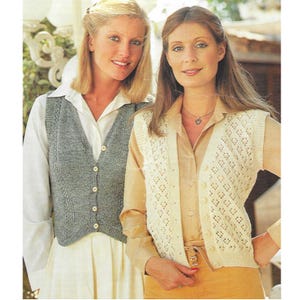 May include: Two women wearing knitted vests over button-down shirts. One vest is gray and solid, the other is cream-colored with a diamond pattern. Both vests have button closures and a V-neck design.