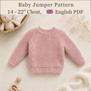 May include: A dusty pink knitted baby jumper with long sleeves, a round neckline, and ribbed cuffs and hem. The text at the top reads Baby Jumper Pattern, 14 - 22" Chest, English PDF, accompanied by a small United Kingdom flag icon.