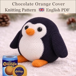 May include: A knitted penguin toy with a dark navy body, white chest, and orange beak and feet. The text Chocolate Orange Cover Knitting Pattern English PDF is displayed above. A box of Terry's Chocolate Orange and a wrapped orange are visible.