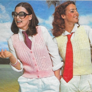 May include: Two people wearing vintage outfits. One person is wearing a pink knitted vest over a white collared shirt and a matching pink tie. The other person is wearing a yellow knitted vest over a white collared shirt and a red tie. Both are wearing sunglasses and white shorts.