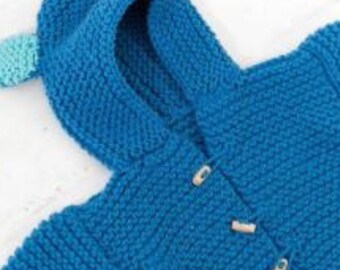 May include: A blue knitted hooded sweater with a dinosaur-like design. The sweater features a hood with light blue accents and wooden toggle closures. The knitwear is a vibrant shade of blue.