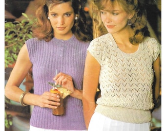 May include: Two women in knitted tops. One wears a sleeveless, lilac ribbed top with buttons. The other wears a short-sleeved, cream top with a geometric pattern. Both are wearing white skirts. The image has a vintage aesthetic.