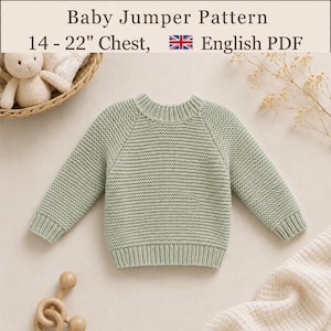 May include: A sage green knitted baby jumper with a textured stitch, long sleeves, and a ribbed crew neckline. The text reads Baby Jumper Pattern 14 - 22" Chest, English PDF. A small plush toy and wooden rattle are visible in the corners.