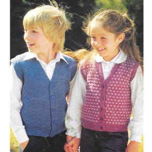 May include: Two children wearing knitted vests. One child is wearing a blue vest with a button-up front over a white collared shirt. The other child is wearing a pink vest with a white pattern and button-up front over a white collared shirt.