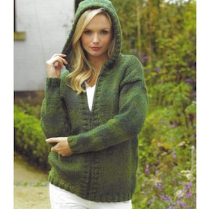 May include: A green hooded sweater with a zipper closure. The sweater is knitted with a textured pattern and has a relaxed fit. The model is wearing a white shirt underneath and white pants.