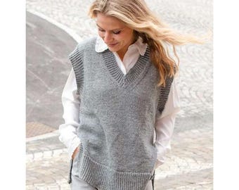 May include: A gray, V-neck sweater vest with ribbed detailing around the neckline, armholes, and hem. The vest is worn over a white collared shirt. The overall style is casual and comfortable, suitable for layering.