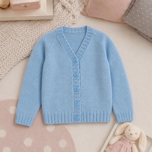 May include: A light blue long-sleeve knit cardigan featuring a V-neckline, a ribbed collar, ribbed cuffs, and a ribbed hem. The front of the garment is secured with five matching light blue buttons arranged in a vertical line down the centre.