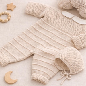 May include: A set of three ceramic mugs with a speckled, cream-colored glaze. Each mug features a different hand-painted floral design in shades of blue, green, and yellow. The mugs have a simple, rounded shape and a comfortable handle.