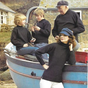 May include: A group of people wearing black turtleneck sweaters and caps posing near a blue boat. The sweaters have a classic, simple design. The scene evokes a nautical or coastal theme.