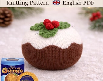 May include: A knitted chocolate orange cover featuring a brown base, a white top, and green leaves with three red berries. The text reads: Chocolate Orange Cover Knitting Pattern English PDF. A box of Terry's Chocolate Orange is shown below.