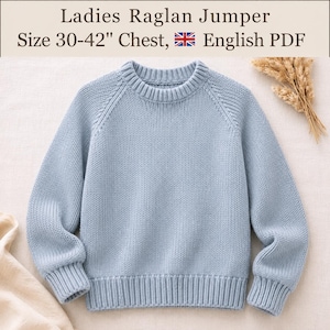 May include: A light blue knit jumper with a crew neckline and raglan sleeves. The text above reads: Ladies Raglan Jumper, Size 30-42" Chest, English PDF. The jumper features a ribbed collar, cuffs, and hem with a consistent knit texture.
