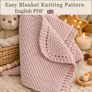 May include: A soft, dusty pink knitted blanket with a textured garter stitch pattern and a decorative eyelet border. The text "Easy Blanket Knitting Pattern English PDF" is displayed at the top of the image above the folded fabric.
