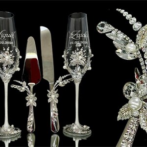 Close-up of luxury bridal jewelry design on silver cake server handle with K9 crystals and pearls.