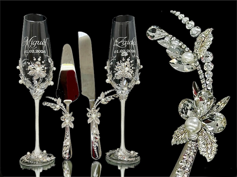 Close-up of luxury bridal jewelry design on silver cake server handle with K9 crystals and pearls.