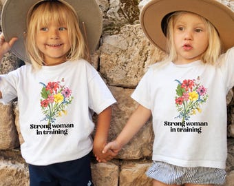 Strong Woman in Training Toddler Tee: Floral Empowerment Shirt