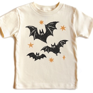 Retro Halloween bat design featuring three playful flying bats with distressed star accents for babies, toddlers, and kids.