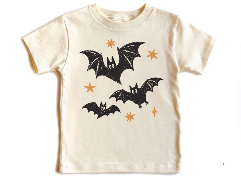 Retro Halloween bat design featuring three playful flying bats with distressed star accents for babies, toddlers, and kids.