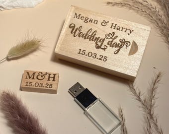 May include: A light-colored wooden sliding box engraved with "Megan & Harry Wedding day 15.03.25", a small rectangular wooden block engraved with "M&H 15.03.25", and a silver and clear acrylic USB flash drive with a metallic connector.