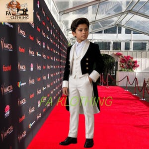 May include: A formal three-piece suit featuring a black velvet tailcoat with gold buttons, a white waistcoat, a white dress shirt, and white trousers. The ensemble is designed with contrasting black and white elements, including white cuffs on the sleeves of the tailcoat, creating a structured and elegant appearance for formal occasions.