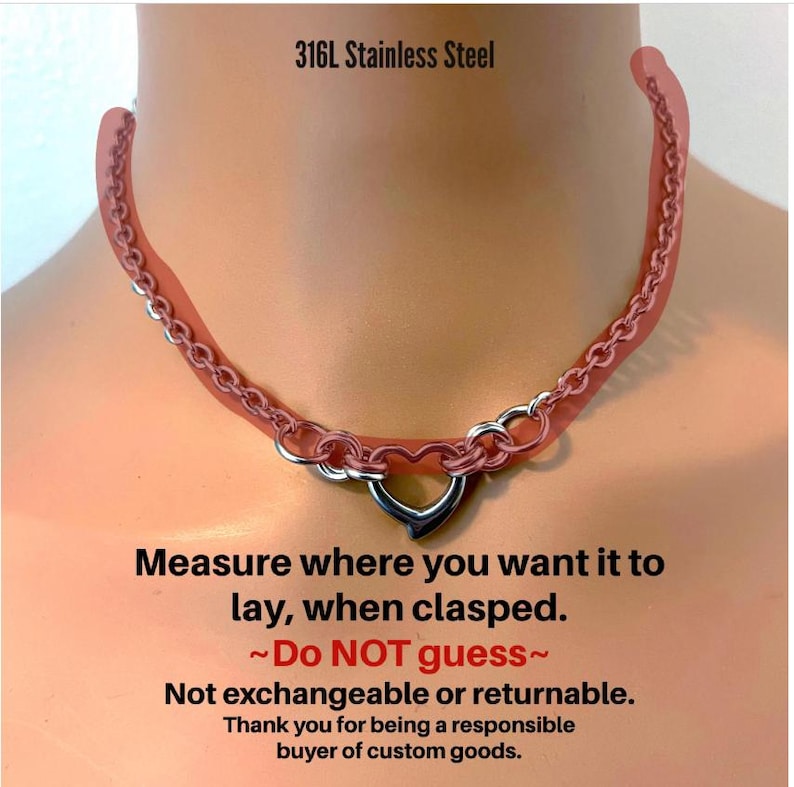 The image is a close-up of a red necklace with a heart-shaped clasp, accompanied by a warning message about the necklace's clasping mechanism.