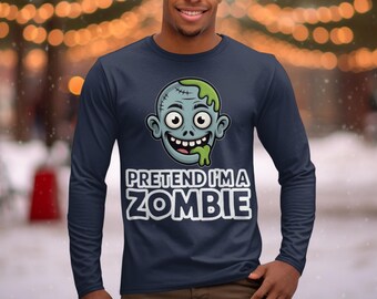 May include: Navy blue long-sleeve shirt featuring a cartoon zombie head with green slime and the text "PRETEND I'M A ZOMBIE" in white. The zombie has stitches and wide eyes. The shirt is made of a soft material.