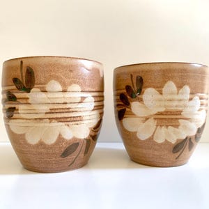 2 vintage pottery coffee cups with flowers