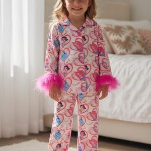 May include: A set of three ceramic mugs with a speckled, matte finish. Each mug features a different color: light blue, cream, and gray. The mugs have a simple, modern design and a comfortable handle.