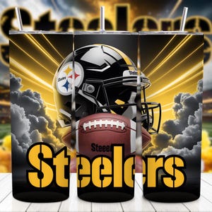 May include: A black tumbler featuring a football helmet and football with the Steelers logo. The word "Steelers" is displayed in yellow block letters. The background has yellow streaks and a cloudy effect.