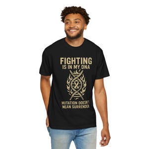 May include: A black t-shirt with a gold graphic design featuring a DNA strand with swords and flames. The text "FIGHTING IS IN MY DNA" and "MUTATION DOESN'T MEAN SURRENDER" is printed on the shirt.