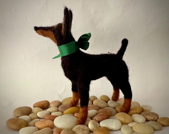 Naaldvilten Dobermann-pinscher puppy