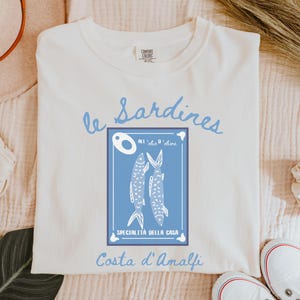Sardines Shirt, Canned Fish T-Shirt, Gift for Foodie and Chef, Gift for Italian Lovers, Amalfi Coast Shirt, Comfort Colors Shirt, Italy Trip,Vintage-style Comfort Colors® t-shirt featuring sardines can illustration with lemon slice and coastal Italian details, foodie aesthetic