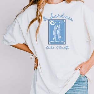 Sardines Shirt, Canned Fish T-Shirt, Gift for Foodie and Chef, Gift for Italian Lovers, Amalfi Coast Shirt, Comfort Colors Shirt, Italy Trip,Vintage-style Comfort Colors® t-shirt featuring sardines can illustration with lemon slice and coastal Italian details, foodie aesthetic