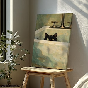 May include: A canvas print depicting a black cat peering over a bathtub's edge. The artwork uses muted green and cream tones, giving it a vintage feel. The cat's eyes are visible, adding a playful element to the scene.