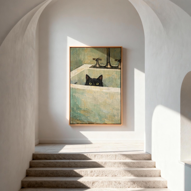 May include: A framed painting of a black cat in a bathtub. The cat's eyes are visible above the tub's edge. The artwork has a vintage aesthetic with a gold frame and a green and white colour palette. The painting is displayed in a bright, white hallway.