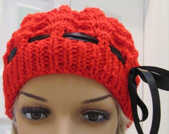 Sale item. HANDKNITTED RED CLOCHE Hat, Cherry red, knitted in a shell pattern with a removable black ribbom trim