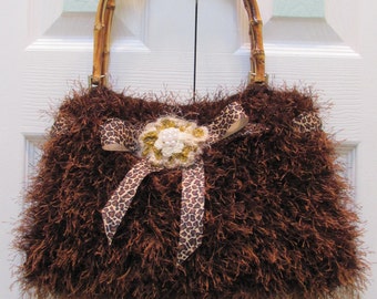 Sale.Handknitted, WOMEN'S HANDBAG/PURSE, Sale item, Chocolate brown fun fur, fully lined, bamboo handles and a crocheted floral center