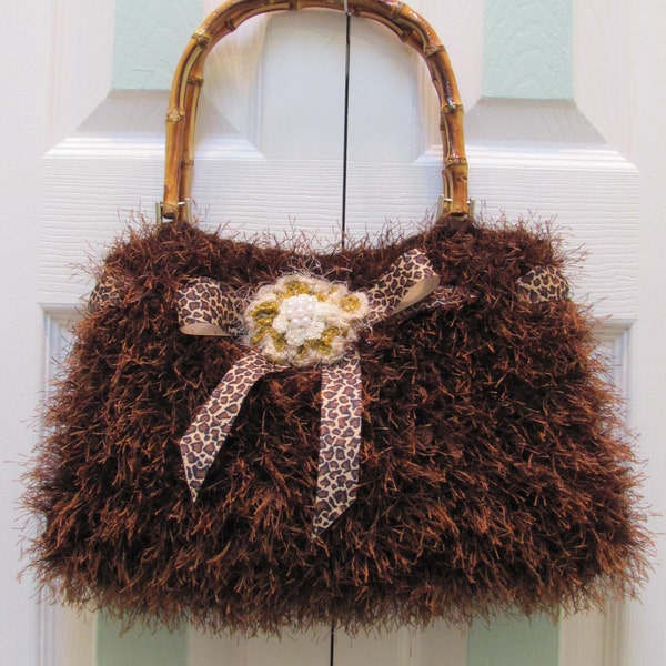 Sale.Handknitted, WOMEN'S HANDBAG/PURSE, Sale item, Chocolate brown fun fur, fully lined, bamboo handles and a crocheted floral center