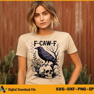 May include: Beige t-shirt with a graphic of a black crow perched on a skull, with the text "F-CAW-F". The design includes a vase of flowers and bare tree branches. The shirt is a digital download file.