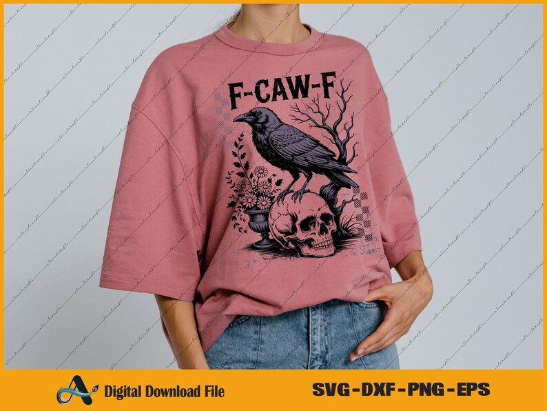 May include: Dusty rose-colored t-shirt with the text "F-CAW-F" above a graphic of a raven perched on a skull. The raven is black, and the skull is white. The shirt is a digital download file.